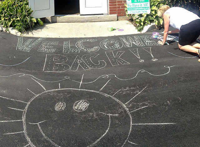 Art Teacher Patti Mehltretter works on a welcome back message as faculty and staff at SS. Peter and Paul School, Hamburg, took the time to start the year of right by creating messages to greet students as they come into the building for their first day. (Courtesy of SS. Peter & Paul School)